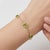 Elevate your everyday style with a vibrant pop of color. This elegant paperclip chain bracelet features four meticulously...