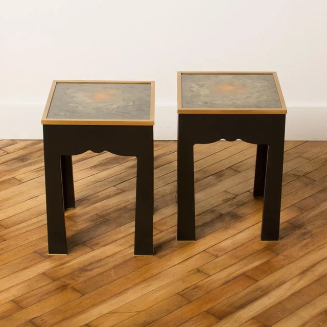 A pair of Salon side tables with layers of hand painted lacquer tops and black lacquer wood base. Contemporary.