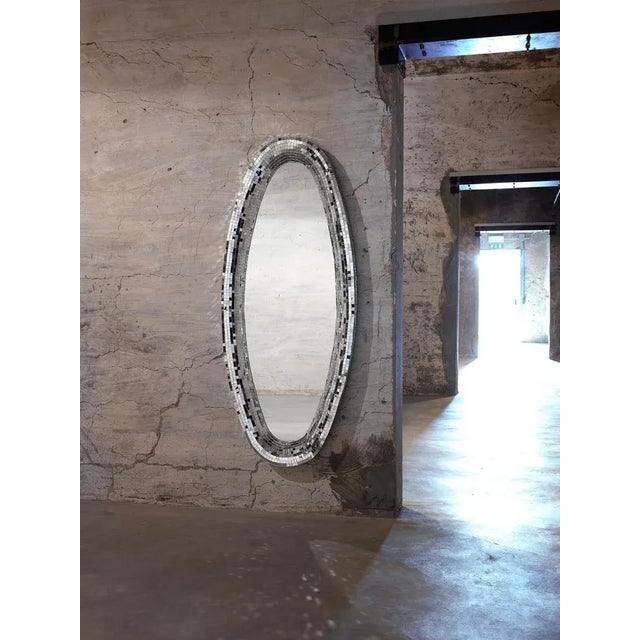 Silver Atollo mirror by Davide Medri Materials: mirror, glass mosaic (silver) Also available in gold. Dimensions: H 170 x...