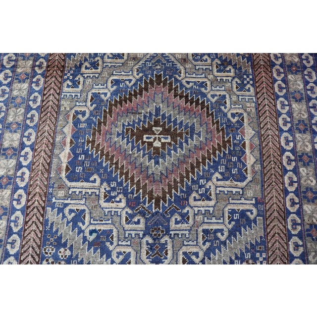 This Belouch Taimani Hand knotted Afghan Fine wool rug with its Geometric pattern is a beautiful addition to any home. The...
