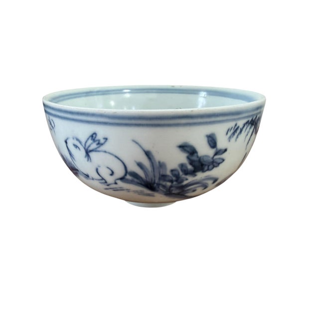 Superb vintage Chinoiserie rice bowl in blue and white porcelain with hand-painted imagery of rabbits, willow branches,...