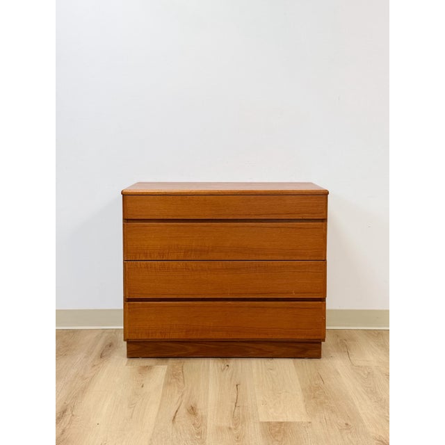 This vintage Danish chest showcases the clean, functional beauty of authentic mid-century Scandinavian design, crafted...