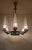A rare French chandelier boasts six rocket-shaped glass shades on six gently curved arms, adorned with beautifully...