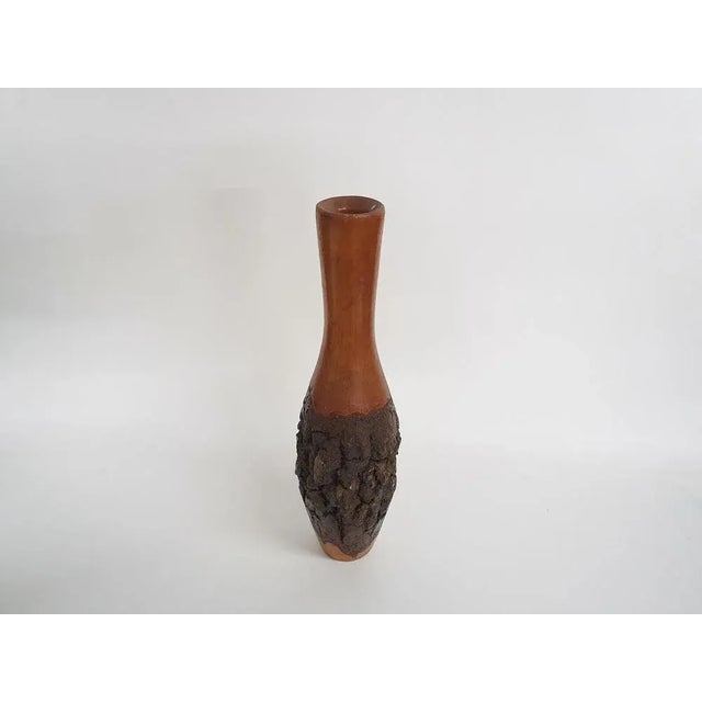 Wooden carved vase with tree bark. Wabi Sabi style.