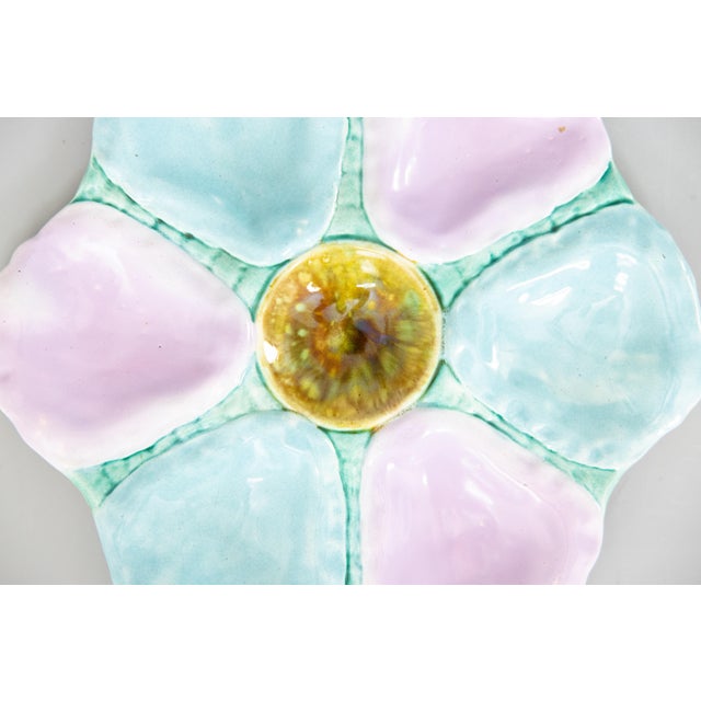 A gorgeous antique 19th-Century English majolica oyster plate, circa 1870-1890. This fine quality oyster plate has six...