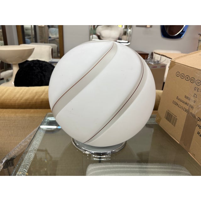 Italian Modern Murano Glass Lamp. Offered is a stunning Murano glass sphere form table lamp on a chrome base. This Italian...