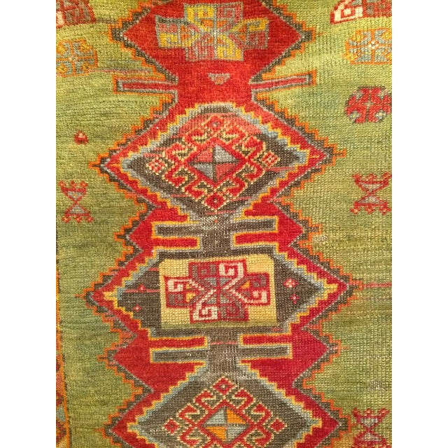 This vintage Turkish Oushak area rug showcases a rare and captivating color palette with a mellow abrash green and yellow...
