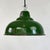 An industrial pendant light by maxlume, with a pressed steel shade in green vitreous enamel outside and white enamel...