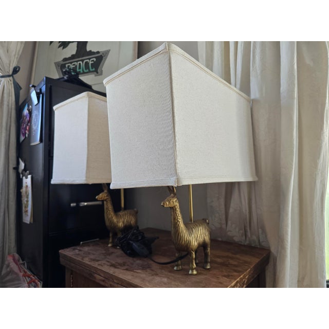 Add a touch of brilliant whimsy to your space with this delightful pair of golden llama table lamps! Cast in beautifully...
