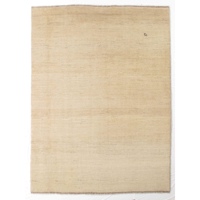 Vintage hand-knotted Persian Gabbeh rug featuring a minimalist field with subtle tonal variation and soft abrash. Gabbeh...