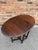 This finely crafted antique gateleg table is constructed of solid English oak with a rich, deep patina developed over...