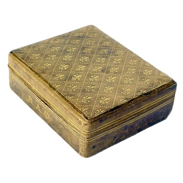 Antique Italian Florentine fleur de lis leather covered lidded box with green silk underside. Gilt and embossed diamond &...