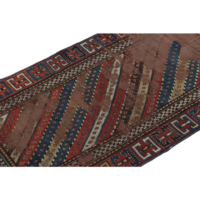Hand-knotted in wool and hailing from Russia circa 1910-1920, this 3x6 antique Kazak runner rug is a rare Caucasian tribal...
