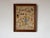 A charming vintage framed needlepoint textile featuring a delightful whimsical domestic scene filled with nostalgic...