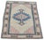 Hand-knotted with care using traditional rug-making techniques, this wool rug blends timeless craftsmanship with a modern...