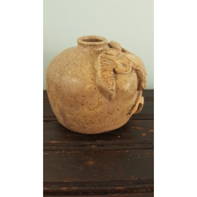 This is a wonderful example of Edgefield SC pottery. THis face vessel has the crude applied facial features and the lipped...