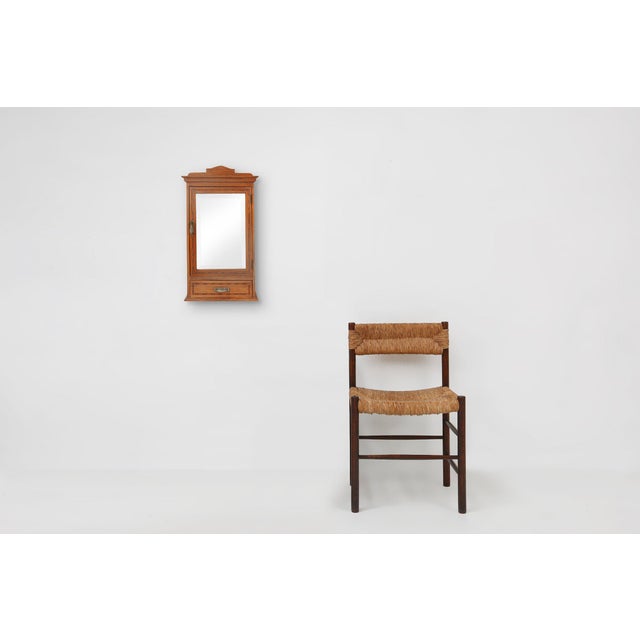 French small mirror door wall cabinet with beautiful wood inlay and a drawer. Made in the Art deco period in France, ca....