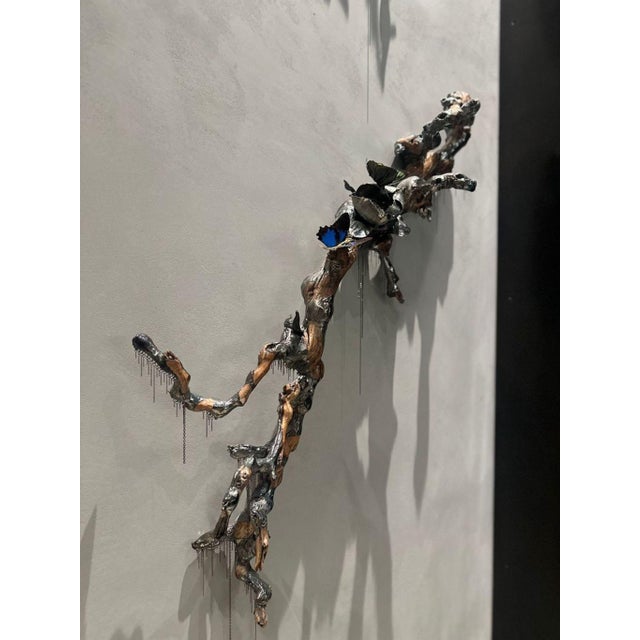 This unique sculpture set by Jocelyn Marsh features lifelike branches adorned with dripping chain detailing. Perfect for...