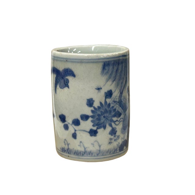 This charming small blue and white porcelain holder stands at 3.75 inches tall and features a classic cylindrical form,...