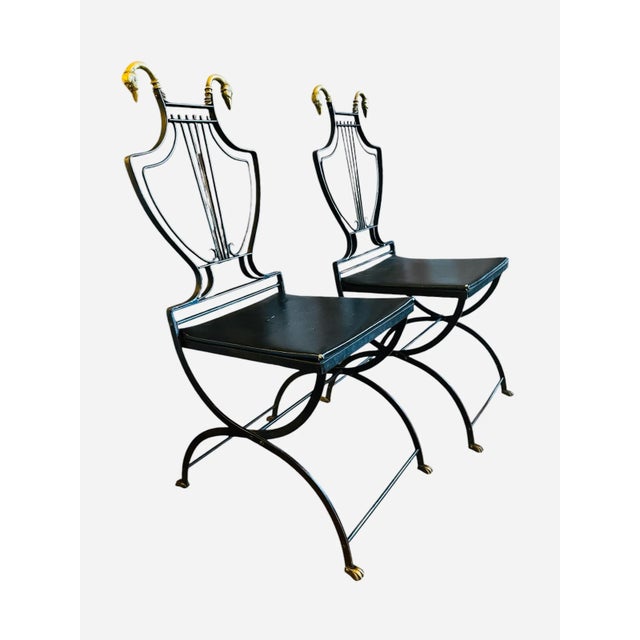 Maison Jensen style cast iron chairs. These vintage folding chairs manufactured in a neoclassical design with black Lyre...