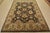 A traditional Agra rug is hand-knotted with fine wool on a cotton foundation. This rug features a botanical design set...