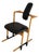 Ergonomically Shaped Flysit Rocking Chair in Black Leather Upholstery with Wooden Frame by Peter Opsvik for Stokke For Sale