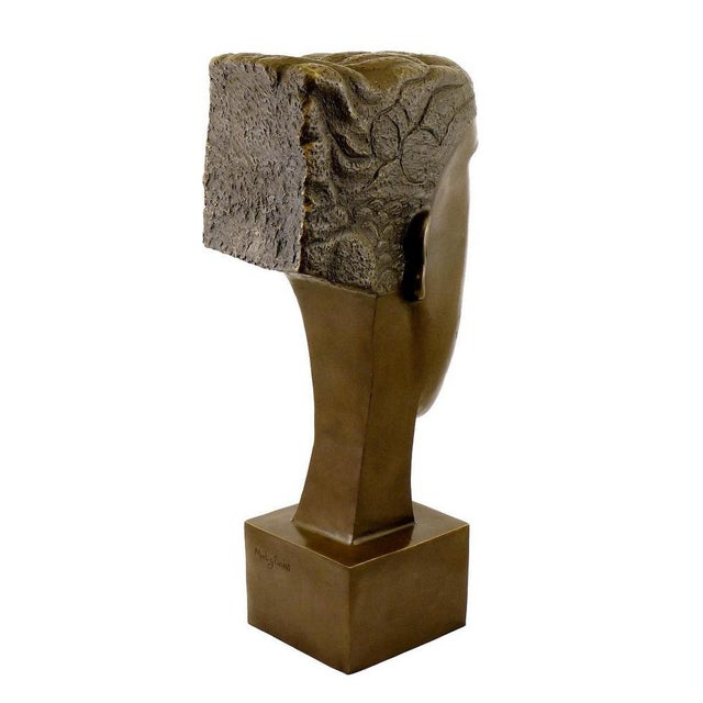 Art Deco style brown patinated bronze sculpture representing a woman’s head. This bronze sculpture is mounted on a square...