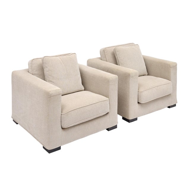 Roche Bobois pair of Cream Cord Armchairs. This pair is upholstered in the original plush cream corduroy fabric. The...