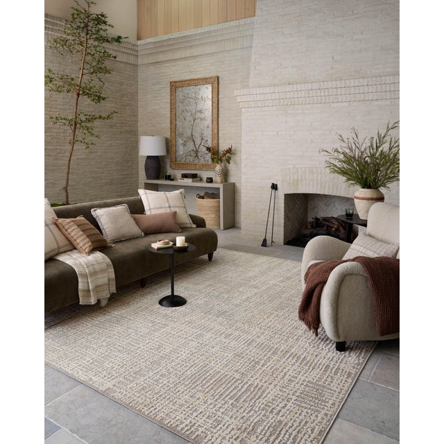 The Bexley Collection is a modern area rug with a loosely structured, organic design from Amber Lewis x Loloi. The rug...