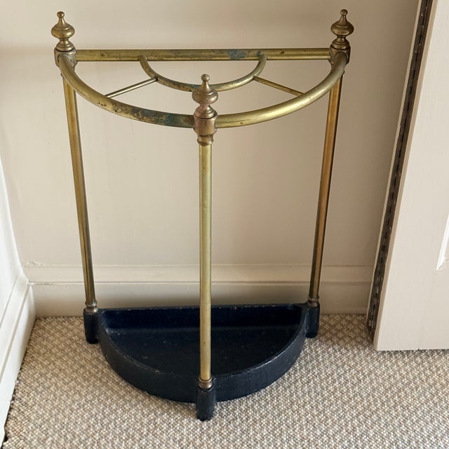 Antique Brass And Cast Iron Stick Stand Early 20th century umbrella or stick stand. Brass has age appropriate verdigris...