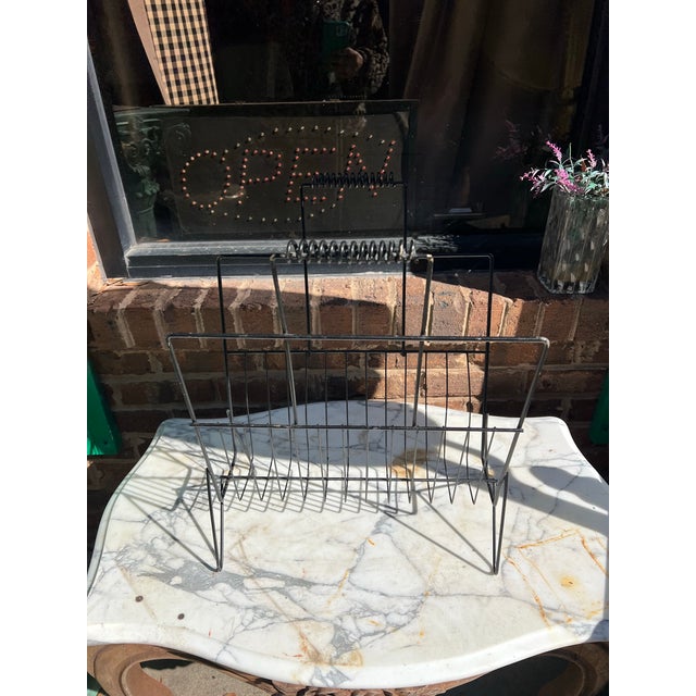 Up for consideration is a beautiful vintage mid century black metal magazine rack. This would look lovely in your home and...