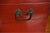 An antique Chinese red lacquered table top-sized wooden chest, likely a lady's dressing or cosmetic box, with a hinged...