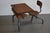 Original school desk from France, 1930s design. The school desk, with its tubular steel frame connecting the desk to the...