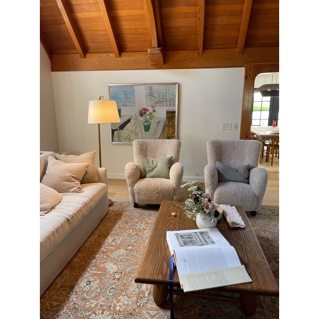 A pair of Flemming Lassen style Sheepskin chairs from Dagmar London. High backed vintage chairs that have been completely...