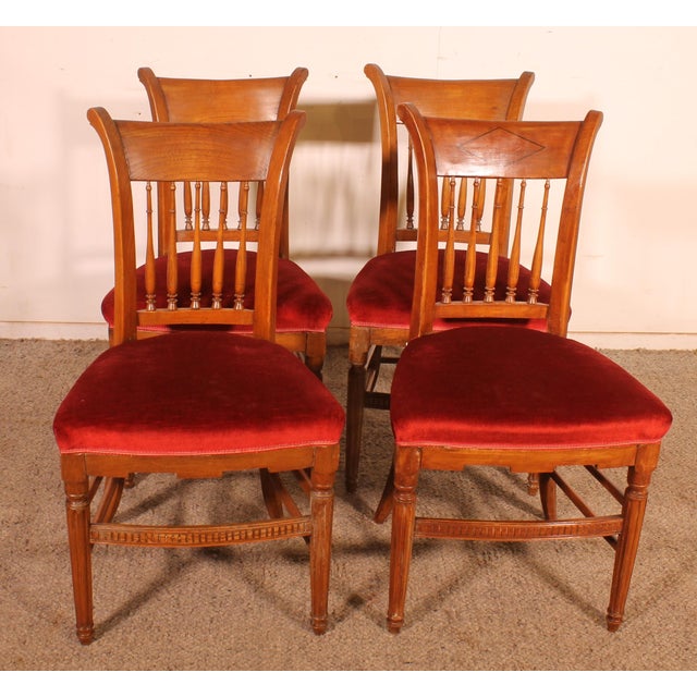 A delightful set of four early 19th-century Directoire period cherrywood chairs. This beautiful set is of superb quality...