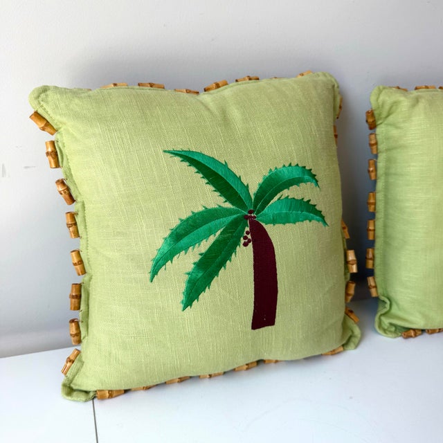 Vintage pair of palm tree embroidered grasscloth and bamboo fringed throw pillows. The pair have unique sewn bamboo trim...