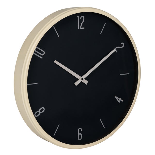The Braxton Wall Clock makes a refined statement with its crisp white frame, clean navy face, and classic white numerals...