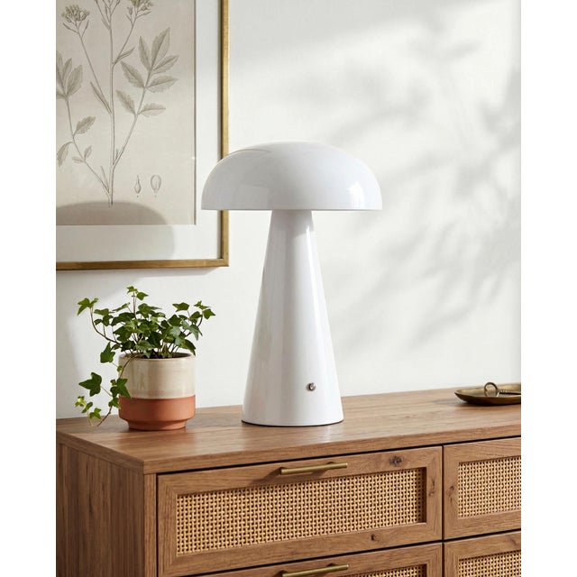 Illuminate your space with the chic and portable Umbra accent table lamp, a beacon of minimalist modern style. Standing at...
