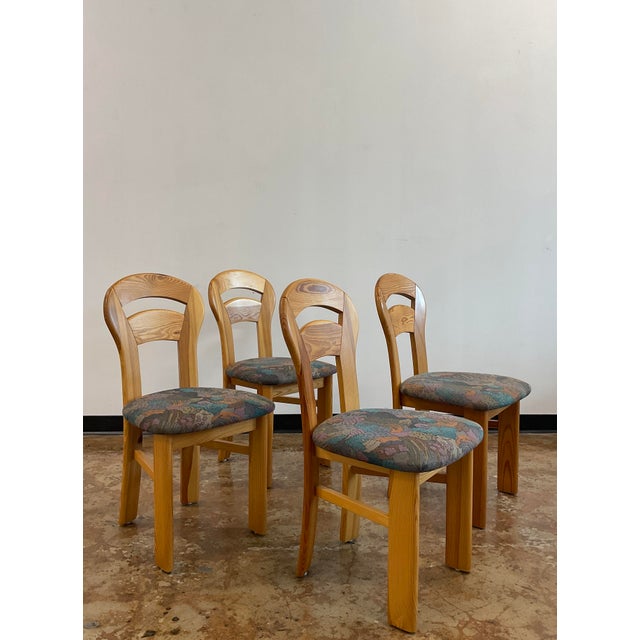 Infuse your dining room with Scandinavian warmth and architectural grace with this set of four (4) vintage Danish Modern...