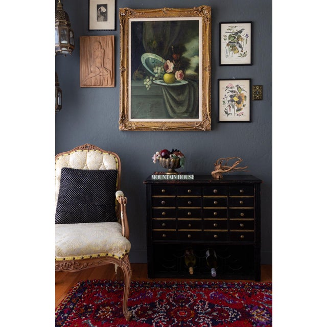A pair of Audubon-style vintage bird and botanical prints by Arthur Singer (1917–1990) framed in their original black wood...