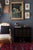 A pair of Audubon-style vintage bird and botanical prints by Arthur Singer (1917–1990) framed in their original black wood...