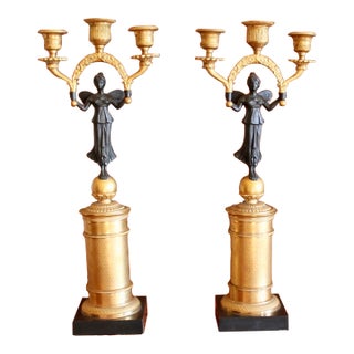 Pair of Continental Gilt Figural Neoclassical Candelabra For Sale