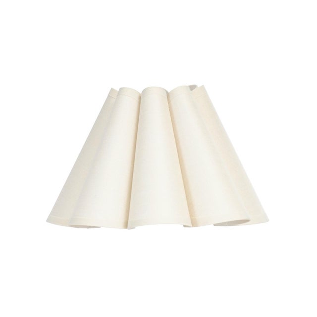 Crafted from linen in a soft Oyster hue, the Polly Alternate Shade features a gently scalloped form that adds quiet...