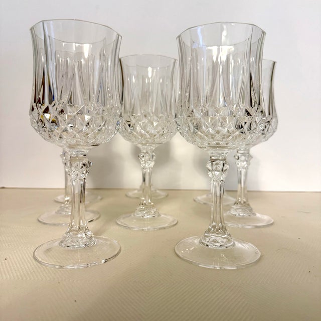 This set of eight vintage Longchamp wine glasses reflects the crisp geometry and elegant proportions associated with mid-...