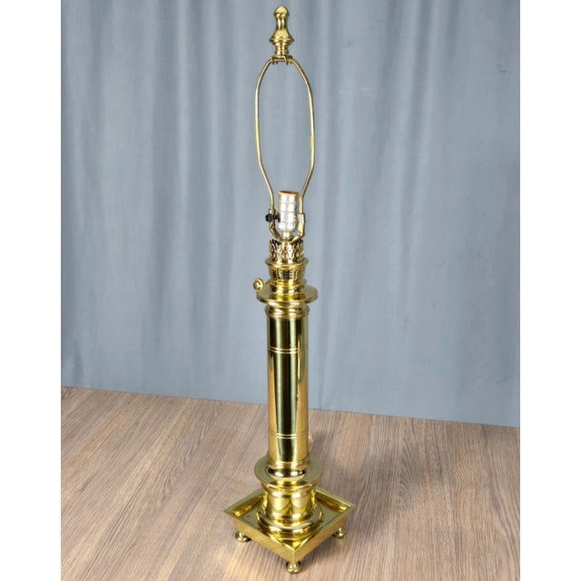 Solid brass lamp and finial, footed lamp in a faux lantern motif. Socket has been replaced, sticker was lost and this is...