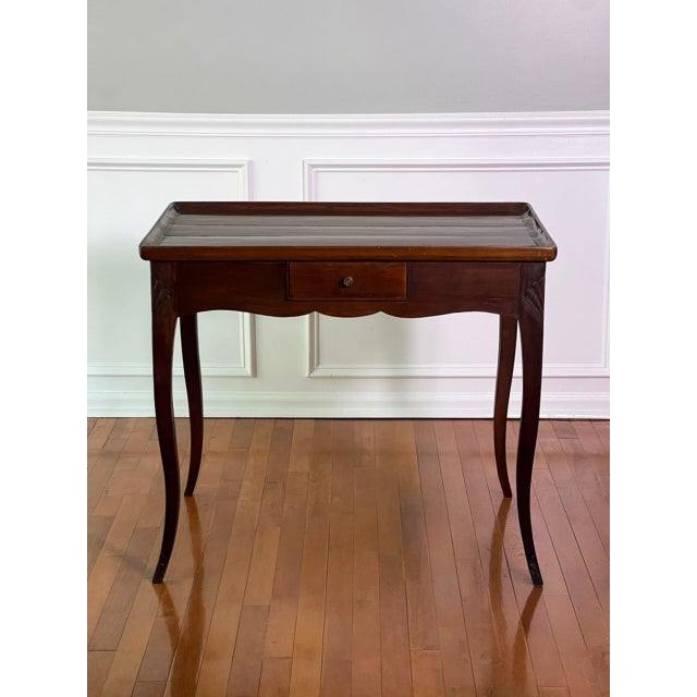 Antique French Provincial Louis XV style mahogany side or tea table, circa 1900. A special table exuding elegant...