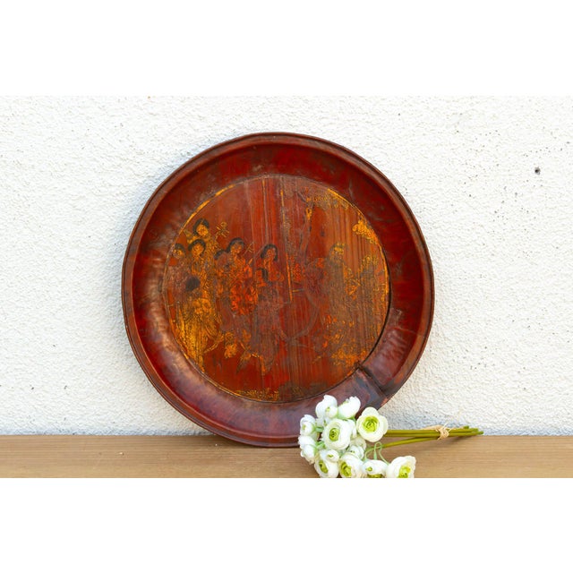 This expansive tray is a definitive example of traditional East Asian lacquerwork, notable for its rich vermilion and deep...