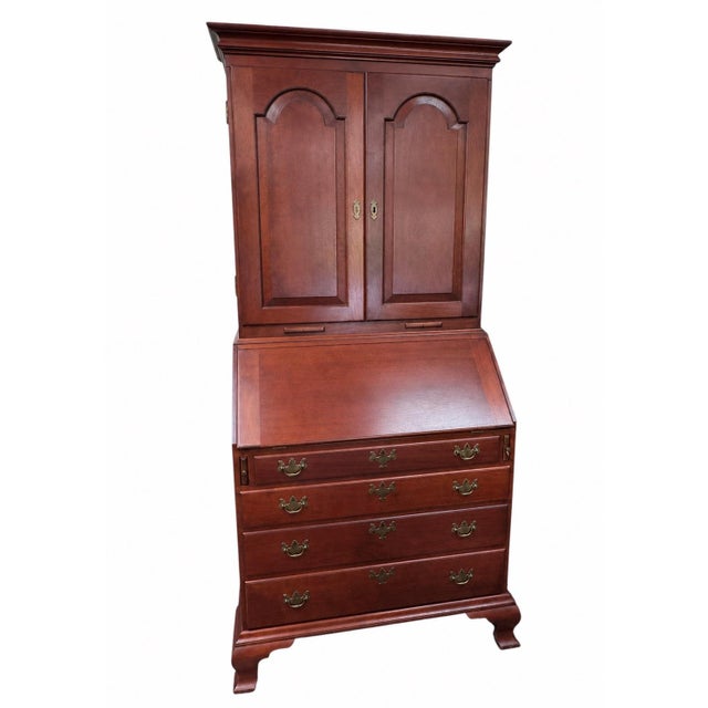 An exceptional bench-made cherry secretary desk and bookcase by the renowned Massachusetts cabinetmaker Eldred Wheeler,...