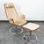 Iconic "Jetson" lounge chair and ottoman designed by Bruno Mathsson for Dux. This chair features a tan leather cushion,...