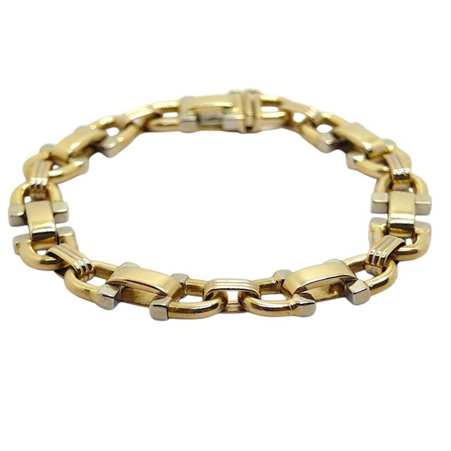 Vintage Italian 18K bracelet featuring a series of white and yellow gold interlocking stirrup links. Measurements: Length:...